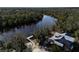 Waterfront home featuring private dock access to a river surrounded by lush greenery at 3407 155Th E Ave, Parrish, FL 34219