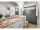 Bathroom with granite countertops, double sinks, glass enclosed shower and tile flooring at 6815 Turnberry Isle Ct, Lakewood Ranch, FL 34202
