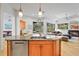 Gourmet kitchen featuring granite countertops, stainless steel appliances, and seamless access to the living area at 6815 Turnberry Isle Ct, Lakewood Ranch, FL 34202