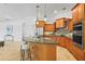 Gourmet kitchen featuring granite countertops, custom cabinets, and stainless steel appliances at 6815 Turnberry Isle Ct, Lakewood Ranch, FL 34202