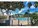 Community pool surrounded by lush tropical landscaping, offering a relaxing oasis for residents at 7628 Whitebridge Gln, University Park, FL 34201