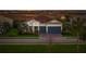 Beautiful single-story home featuring a symmetrical facade, manicured lawn, and a two-car garage at 8358 Redonda Loop, Lakewood Ranch, FL 34202