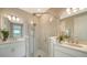 Elegant bathroom featuring a glass shower and double vanity sinks at 10109 Milky Way Cir, Sarasota, FL 34241