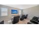Spacious home theater room with leather reclining chairs and large flat screen television at 10109 Milky Way Cir, Sarasota, FL 34241