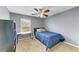Cozy bedroom with neutral walls and a window for natural light; perfect for a relaxing retreat at 223 Heritage Isles Way, Bradenton, FL 34212