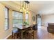 Bright dining area featuring a pendant light and large windows with outdoor views and seating for four at 223 Heritage Isles Way, Bradenton, FL 34212