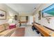 Recreation room featuring a foosball table, shuffleboard, and comfortable seating for entertainment at 223 Heritage Isles Way, Bradenton, FL 34212