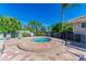 Community hot tub surrounded by a brick patio and landscaping at 223 Heritage Isles Way, Bradenton, FL 34212