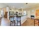 Eat-in kitchen features a breakfast bar with seating, and stainless steel appliances at 223 Heritage Isles Way, Bradenton, FL 34212