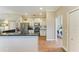 Bright kitchen boasts ample cabinet space, stainless steel appliances, granite counters and views to the laundry room at 223 Heritage Isles Way, Bradenton, FL 34212