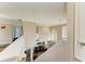 Upper-level loft area overlooking the home's entryway and featuring an elegant arched window at 223 Heritage Isles Way, Bradenton, FL 34212