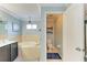The main bathroom includes a soaking tub, toilet room and a double sink vanity with great lighting at 223 Heritage Isles Way, Bradenton, FL 34212