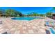 A community pool surrounded by lounge chairs on a sunny day at 223 Heritage Isles Way, Bradenton, FL 34212