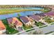 This waterfront community features lush landscaping, a golf course, and homes with tile roofs at 23703 Waverly Cir, Venice, FL 34293