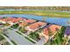 This home boasts beautiful landscaping, tile roof and gorgeous water and golf course views at 23703 Waverly Cir, Venice, FL 34293