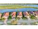 Charming neighborhood homes with tile roofs are nestled along the waterfront and a golf course at 23703 Waverly Cir, Venice, FL 34293