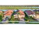 Beautiful single-Gathering home features a tile roof, well-manicured landscaping, and a paver driveway at 23703 Waverly Cir, Venice, FL 34293