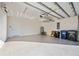 Clean, well-organized three car garage featuring epoxy floors and ample storage space at 23703 Waverly Cir, Venice, FL 34293