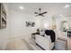 Comfortable living room with tile flooring, neutral furniture, and modern decor at 23703 Waverly Cir, Venice, FL 34293
