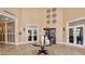 Welcoming lobby with stylish decor, tile floors, and access to the lounge and dining area at 23703 Waverly Cir, Venice, FL 34293