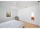 Bedroom featuring a large closet, light hardwood floors, and a window with nice view at 2458 Whippoorwill Cir, Sarasota, FL 34231