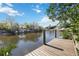 Private boat dock on tranquil waterway, perfect for boating and enjoying waterfront views at 2458 Whippoorwill Cir, Sarasota, FL 34231