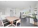 Modern, white kitchen with a center island, stainless steel appliances, and sleek countertops at 2458 Whippoorwill Cir, Sarasota, FL 34231