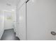 Hallway with a laundry room including a washer and dryer at 2458 Whippoorwill Cir, Sarasota, FL 34231