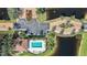 Overhead view of community pool, with ample seating, beside tranquil lake at 400 San Lino Cir # 431, Venice, FL 34292