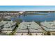 Scenic aerial view showcases the community, lake, and lush surroundings at 6409 Moorings Point Cir # 102, Lakewood Ranch, FL 34202