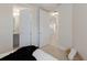 View from a light-filled bedroom to an ensuite bathroom and other parts of the home at 6409 Moorings Point Cir # 102, Lakewood Ranch, FL 34202