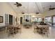 Spacious clubhouse interior featuring dining tables, ceiling fans, and plenty of seating with natural light at 6409 Moorings Point Cir # 102, Lakewood Ranch, FL 34202