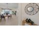 Open-concept dining and living area with stylish decor and lake views at 6409 Moorings Point Cir # 102, Lakewood Ranch, FL 34202
