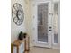 Stylish entryway with a console table, decor, and a door with window blinds at 6409 Moorings Point Cir # 102, Lakewood Ranch, FL 34202
