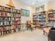 Cozy library filled with bookshelves and comfortable seating, perfect for relaxing and reading at 6409 Moorings Point Cir # 102, Lakewood Ranch, FL 34202