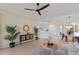 Inviting living room with neutral tones, complemented by a modern ceiling fan and decor at 6409 Moorings Point Cir # 102, Lakewood Ranch, FL 34202