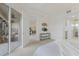 Bright main bedroom with a private screened patio and views to other parts of the home at 6409 Moorings Point Cir # 102, Lakewood Ranch, FL 34202