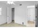 A bright bedroom featuring a ceiling fan, tiled floor, neutral walls, and closet space at 1226 Coral Ridge Dr, Punta Gorda, FL 33950