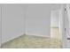 A bright bedroom featuring tile flooring, neutral walls, and a closet at 1226 Coral Ridge Dr, Punta Gorda, FL 33950