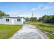 Charming one-story home with a well-maintained lawn and a long driveway at 1226 Coral Ridge Dr, Punta Gorda, FL 33950