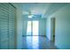 Open living room featuring tile floors, sliding glass door, and a ceiling fan at 1226 Coral Ridge Dr, Punta Gorda, FL 33950