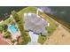 Aerial view showcasing the expansive home, pool, and manicured landscaping at 1327 Wesley Dr, Punta Gorda, FL 33950