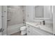 Modern bathroom features updated hardware, white vanity with countertop, and tiled shower at 1327 Wesley Dr, Punta Gorda, FL 33950