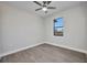 Comfortable bedroom with tile floors, ceiling fan, and a window view at 1327 Wesley Dr, Punta Gorda, FL 33950
