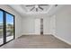 Bright bedroom with sliding glass door, tray ceiling and ample closet space at 1327 Wesley Dr, Punta Gorda, FL 33950