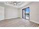 Bedroom with hardwood floors and sliding glass doors to the waterfront at 1327 Wesley Dr, Punta Gorda, FL 33950