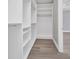 A large walk-in closet featuring adjustable shelving and ample storage space at 1327 Wesley Dr, Punta Gorda, FL 33950
