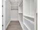 A large walk-in closet featuring adjustable shelving and ample storage space at 1327 Wesley Dr, Punta Gorda, FL 33950