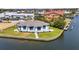 Exterior elevation of waterfront home with clean lines, modern design and access to water at 1327 Wesley Dr, Punta Gorda, FL 33950