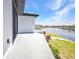 Exterior view of the waterfront home with patio area and grass yard at 1327 Wesley Dr, Punta Gorda, FL 33950